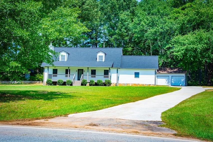 2737 Lake Paradise Road Villa Rica, GA 30180 - Photo 1 of 1 a front view of a house with a yard