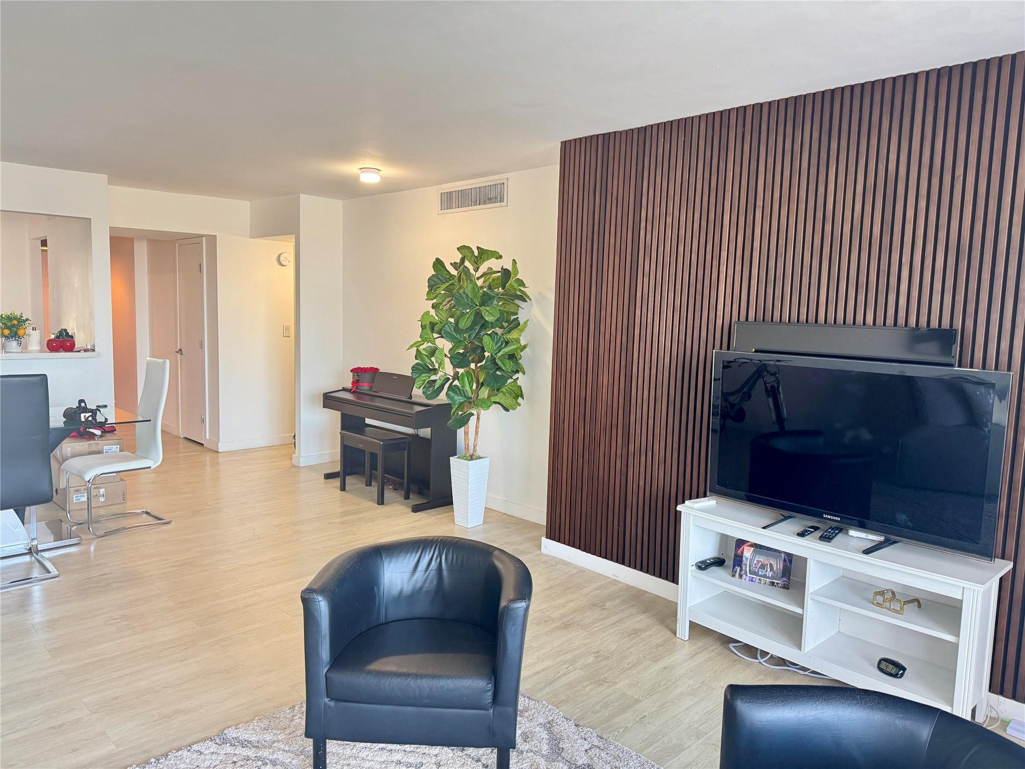 1770 Northeast 191st Street, Unit 816 Miami, FL 33179 - Photo 11 of 33 a living room with furniture and a fireplace