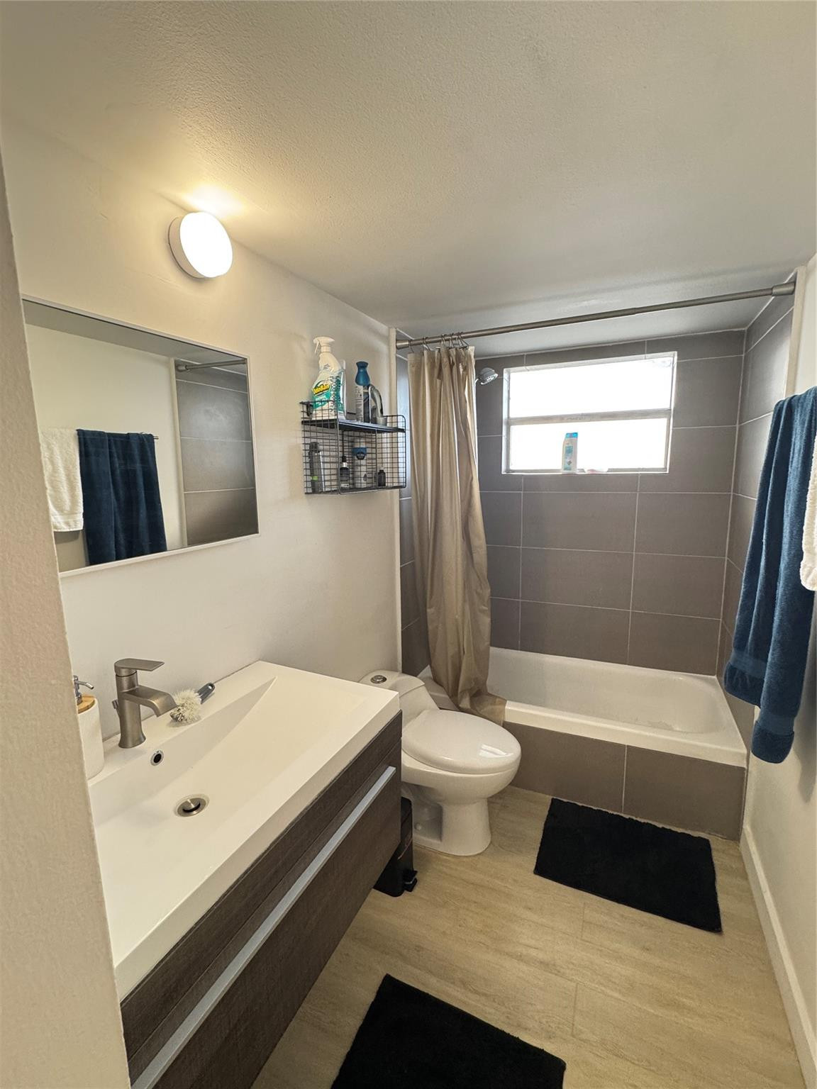 1770 Northeast 191st Street, Unit 816 Miami, FL 33179 - Photo 19 of 33 a bathroom with a sink toilet a mirror and bathtub