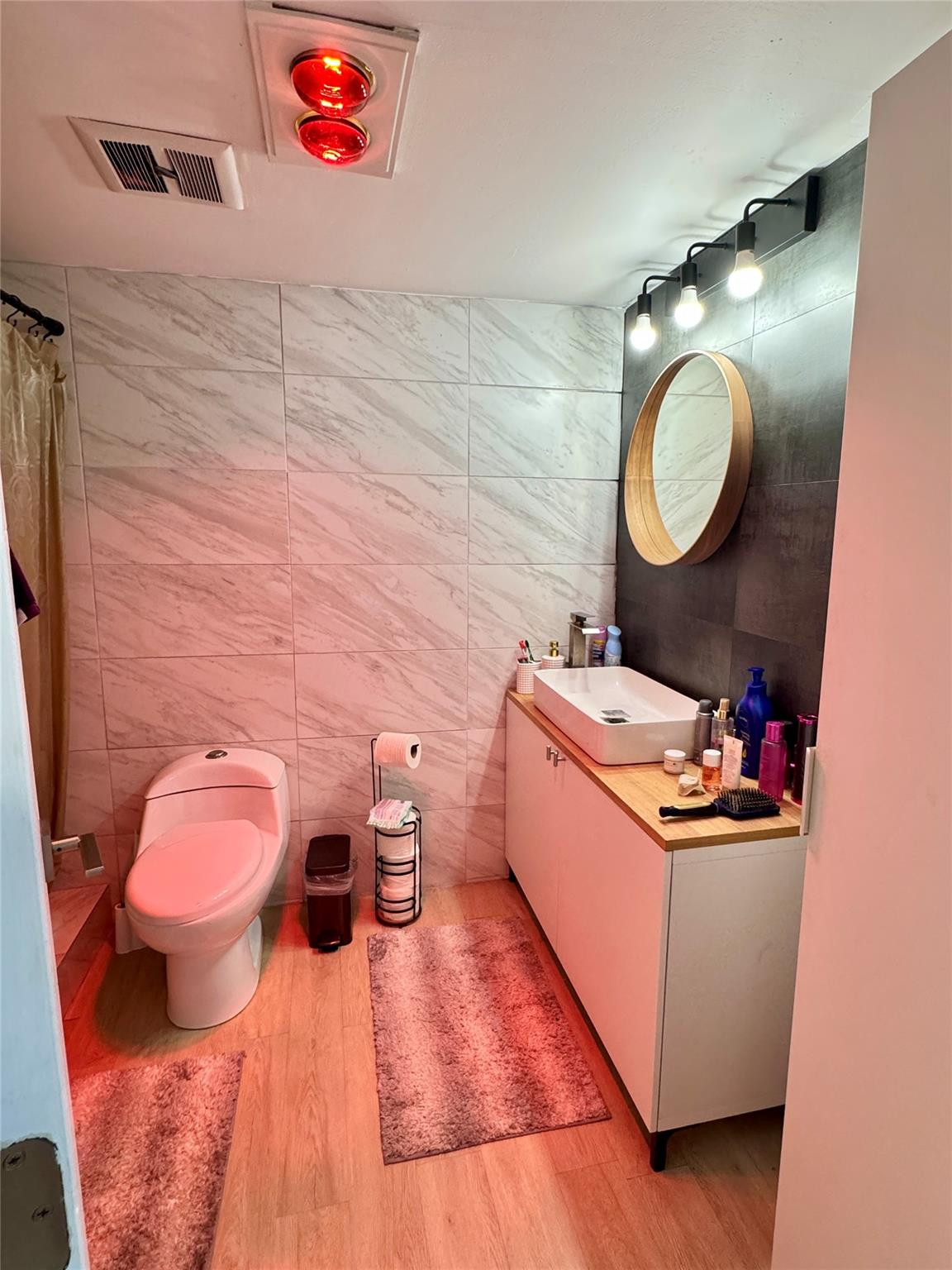 1770 Northeast 191st Street, Unit 816 Miami, FL 33179 - Photo 23 of 33 a bathroom with a sink mirror vanity and toilet