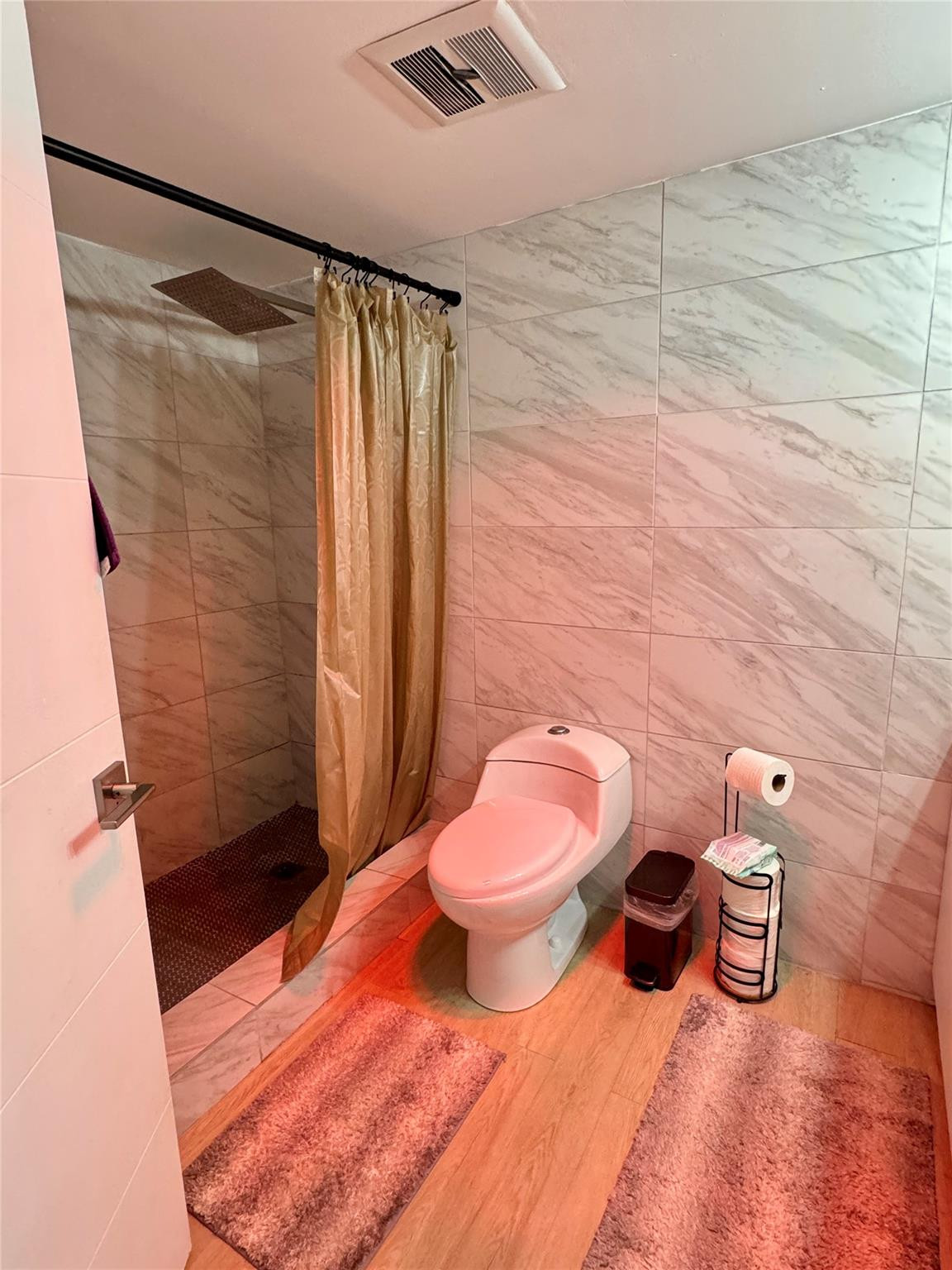 1770 Northeast 191st Street, Unit 816 Miami, FL 33179 - Photo 24 of 33 a bathroom with a toilet and shower