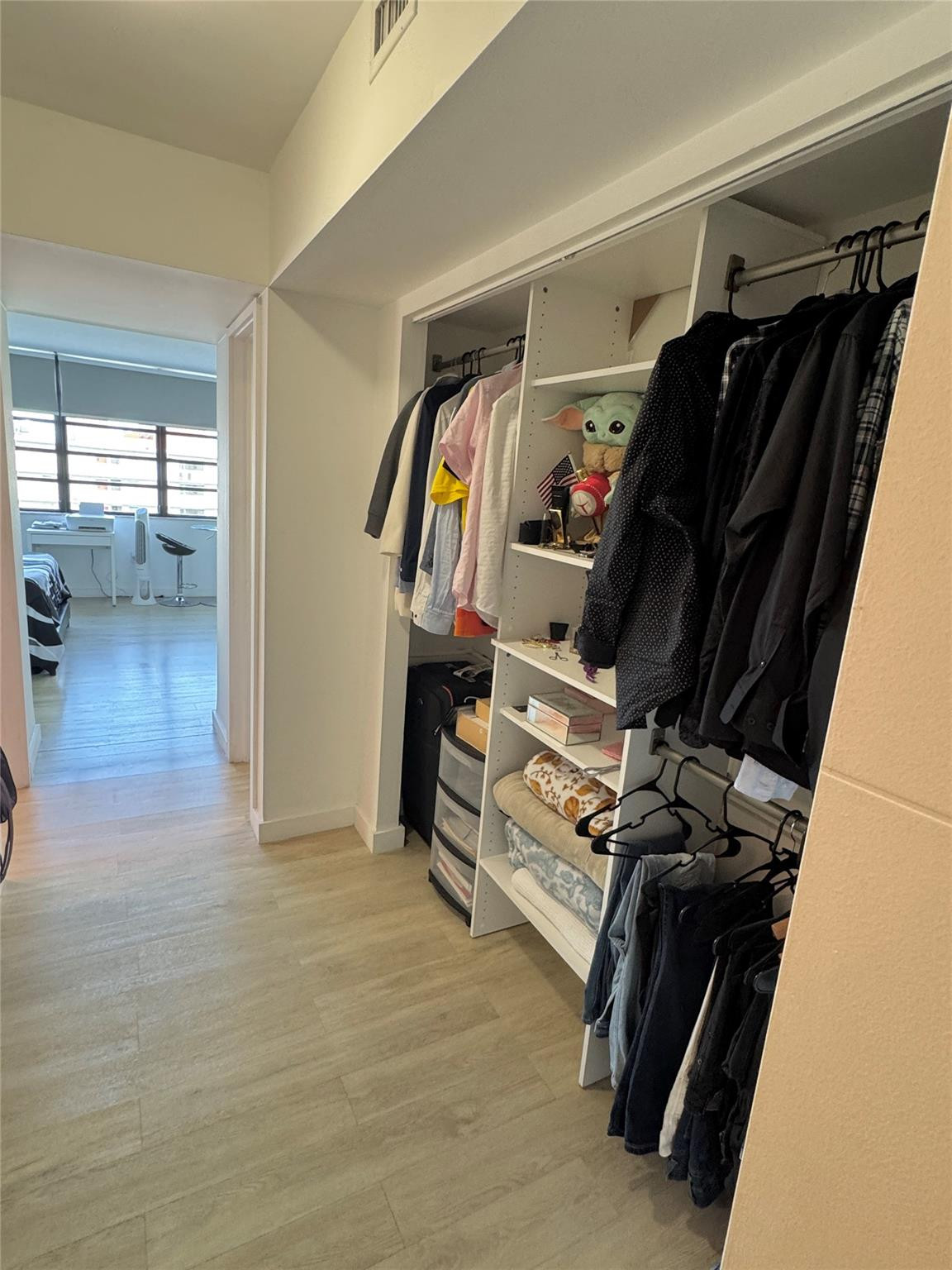 1770 Northeast 191st Street, Unit 816 Miami, FL 33179 - Photo 27 of 33 a view of walk in closet with clothes and shoes