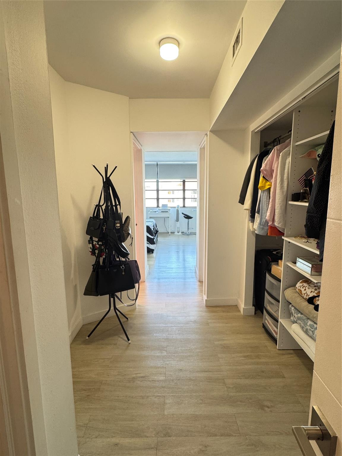 1770 Northeast 191st Street, Unit 816 Miami, FL 33179 - Photo 28 of 33 a view of walk in closet with clothes and shoes
