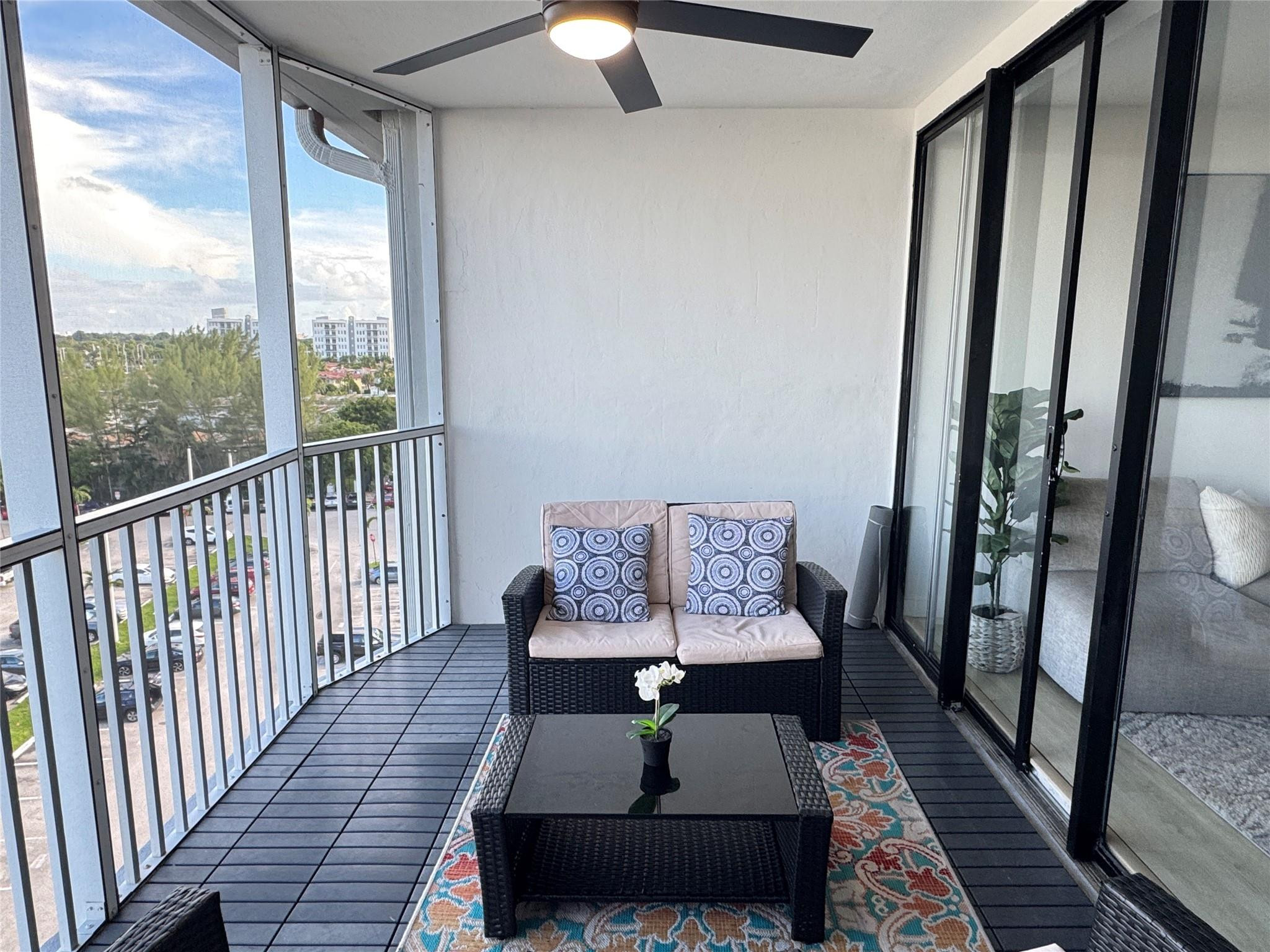 1770 Northeast 191st Street, Unit 816 Miami, FL 33179 - Photo 33 of 33 a living room with furniture and a rug