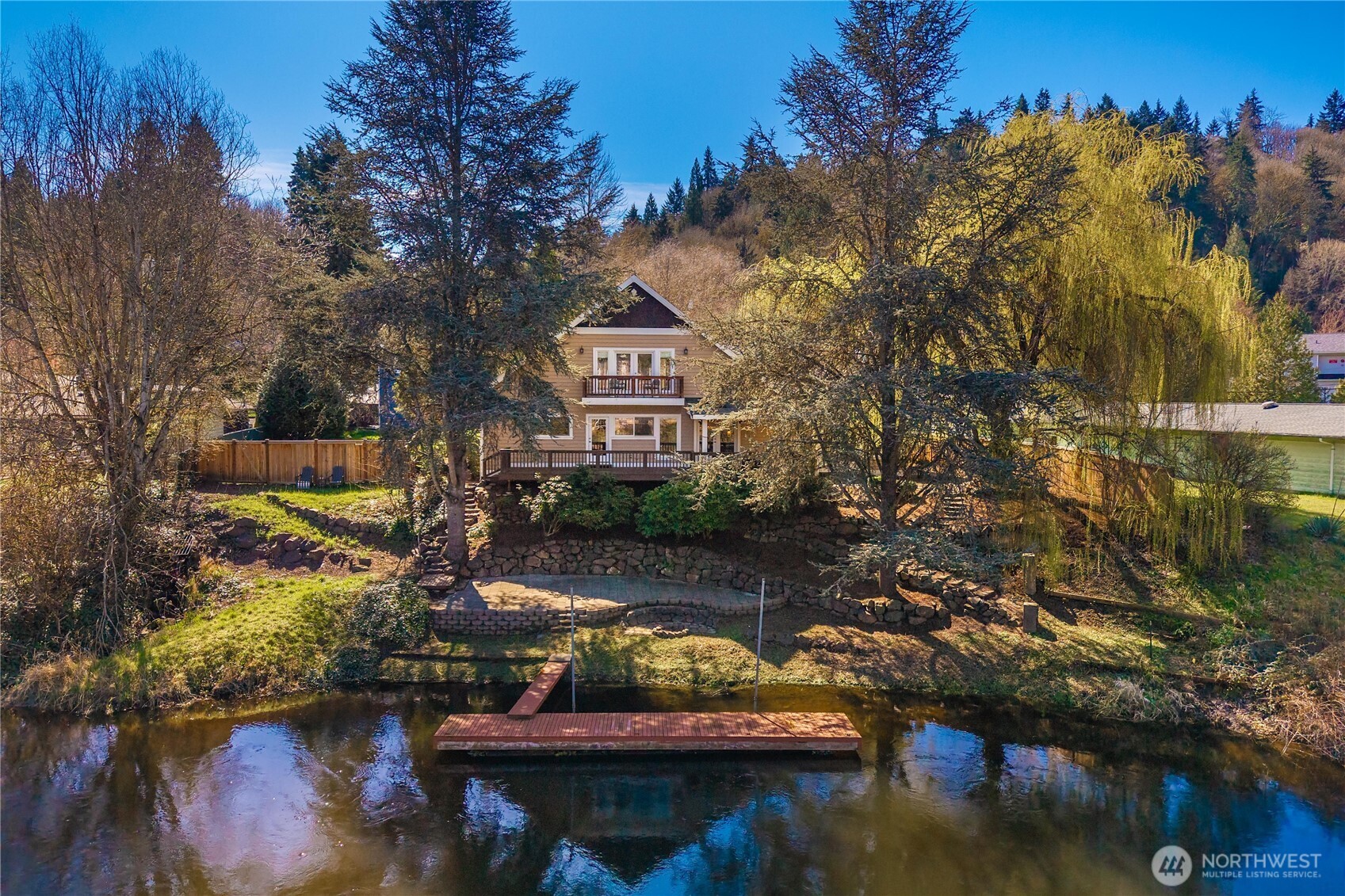 11028 East Riverside Drive Bothell, WA 98011 - Photo 2 of 40 a view of a lake with outside of house