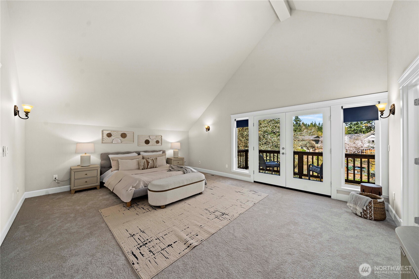 11028 East Riverside Drive Bothell, WA 98011 - Photo 24 of 40 a spacious bedroom with a bed couch and a large window