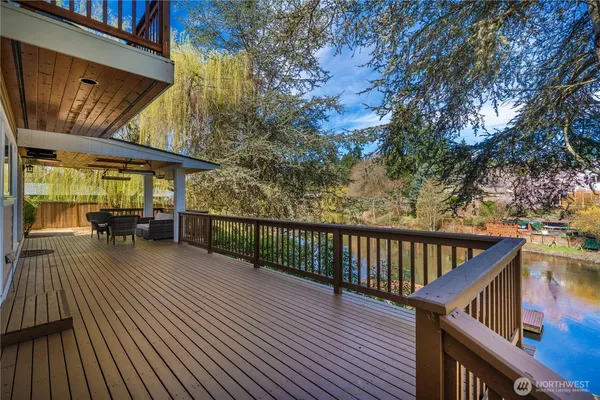 a view of a deck with wooden floor and outdoor space