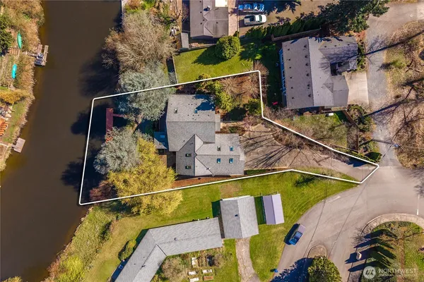 an aerial view of a house with a swimming pool