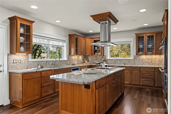 a kitchen with a sink stove and cabinets