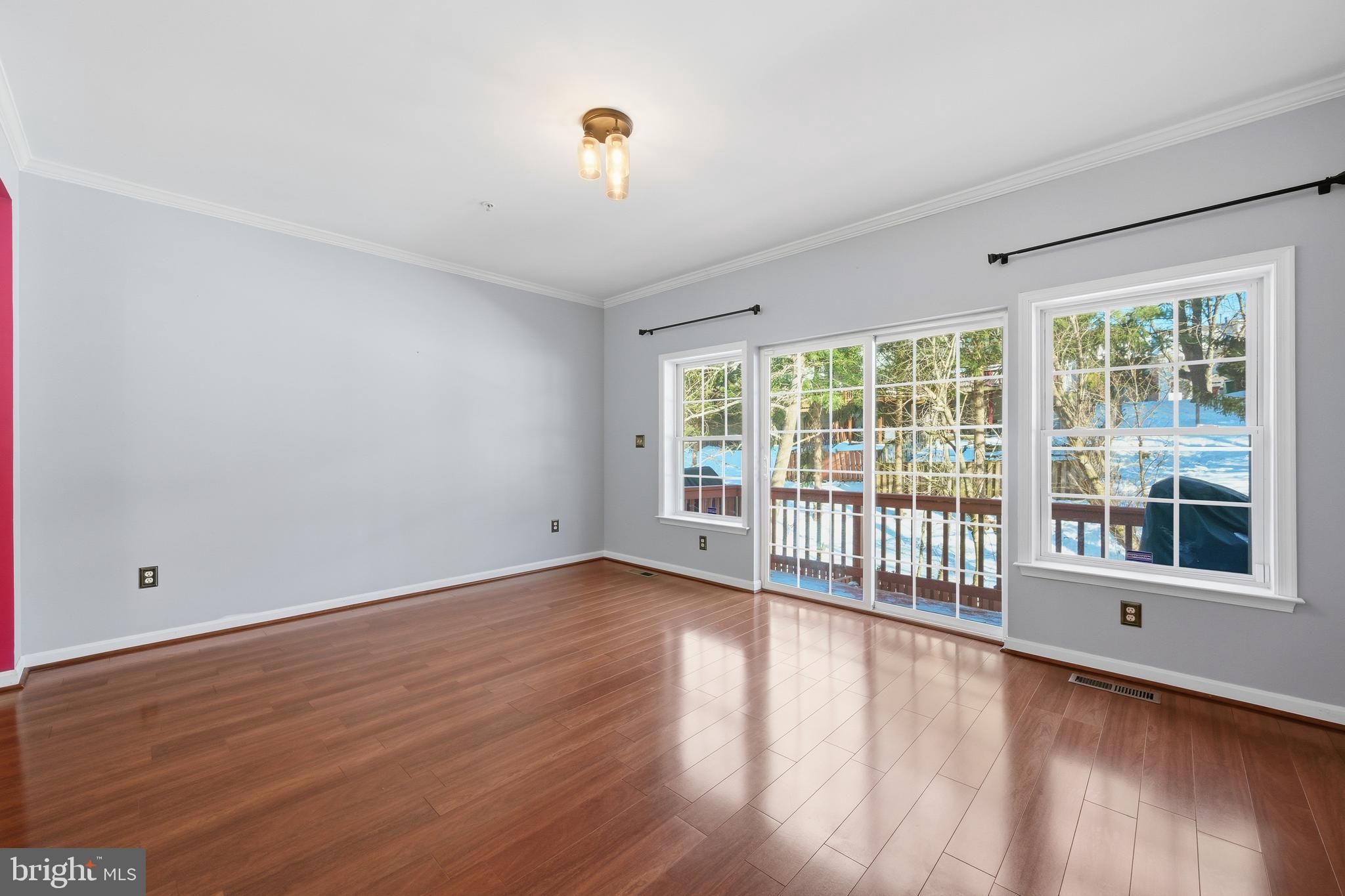 18733 Falling River Drive Gaithersburg, MD 20879 - Photo 4 of 34 a view of a room with wooden floor and windows