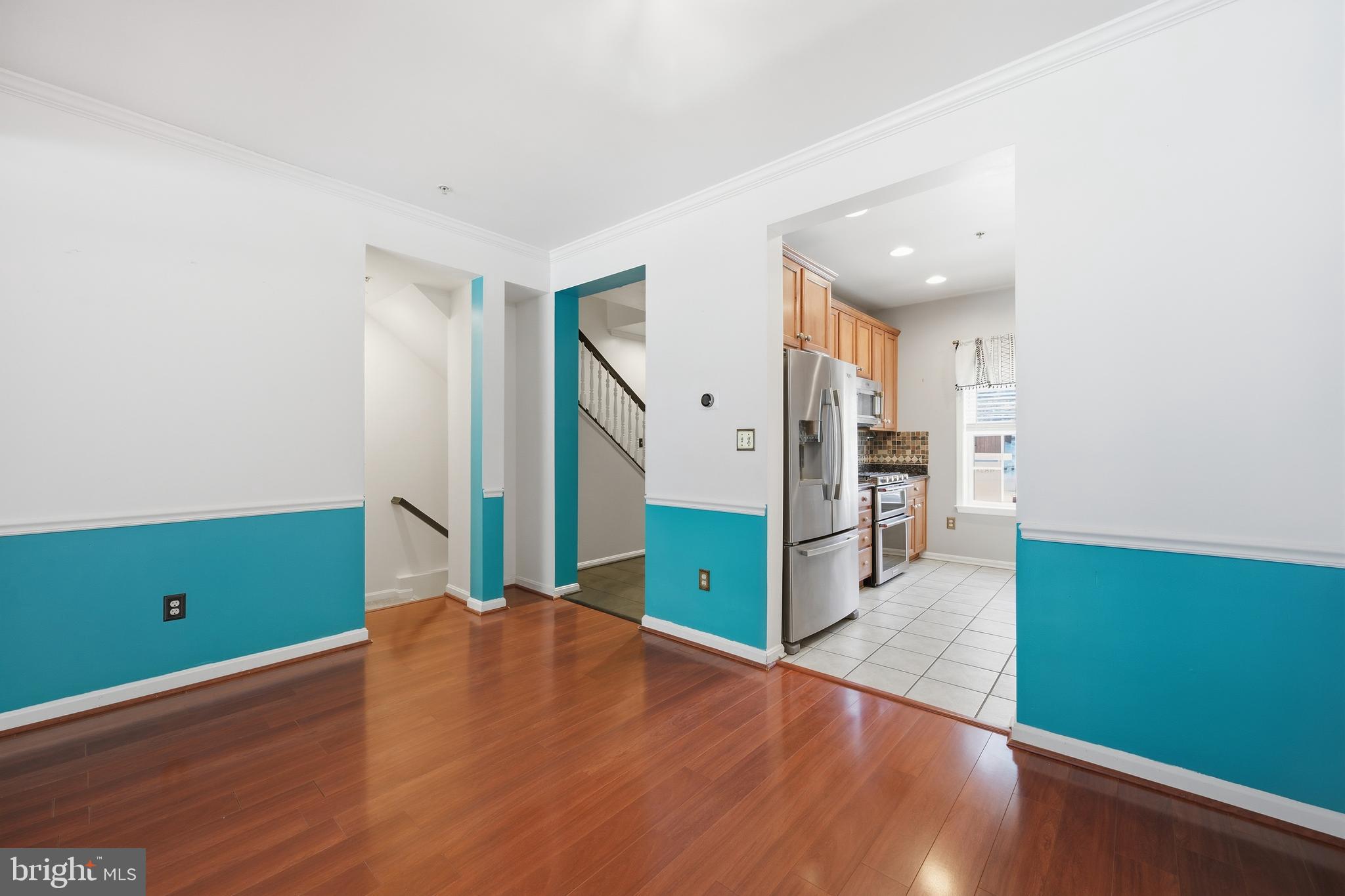 18733 Falling River Drive Gaithersburg, MD 20879 - Photo 9 of 34 an empty room with wooden floor and windows