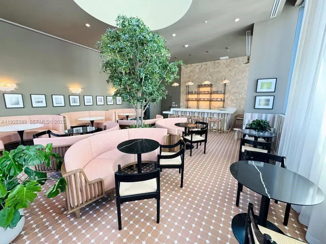 a outdoor space with lots of tables a chair and a fireplace