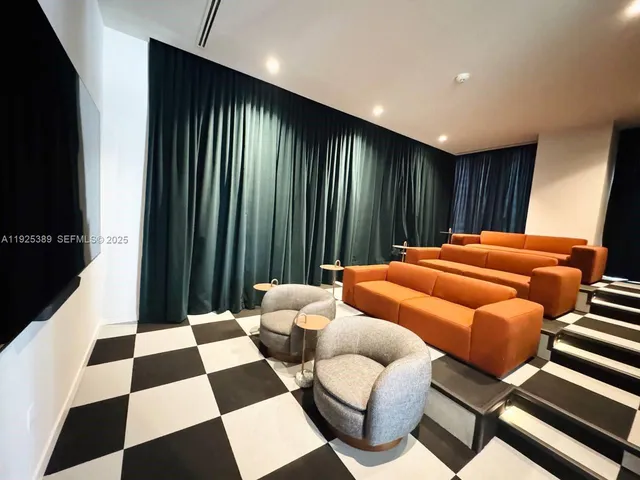 a room with furniture and a rug