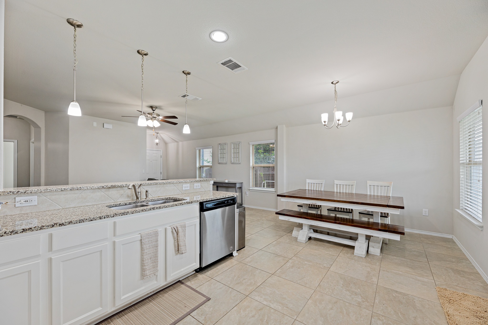 382 Limerick Road Buda, TX 78610 - Photo 6 of 20 Granite counters and stainless steel appliances adorn this functional kitchen with an adjoining dining area.