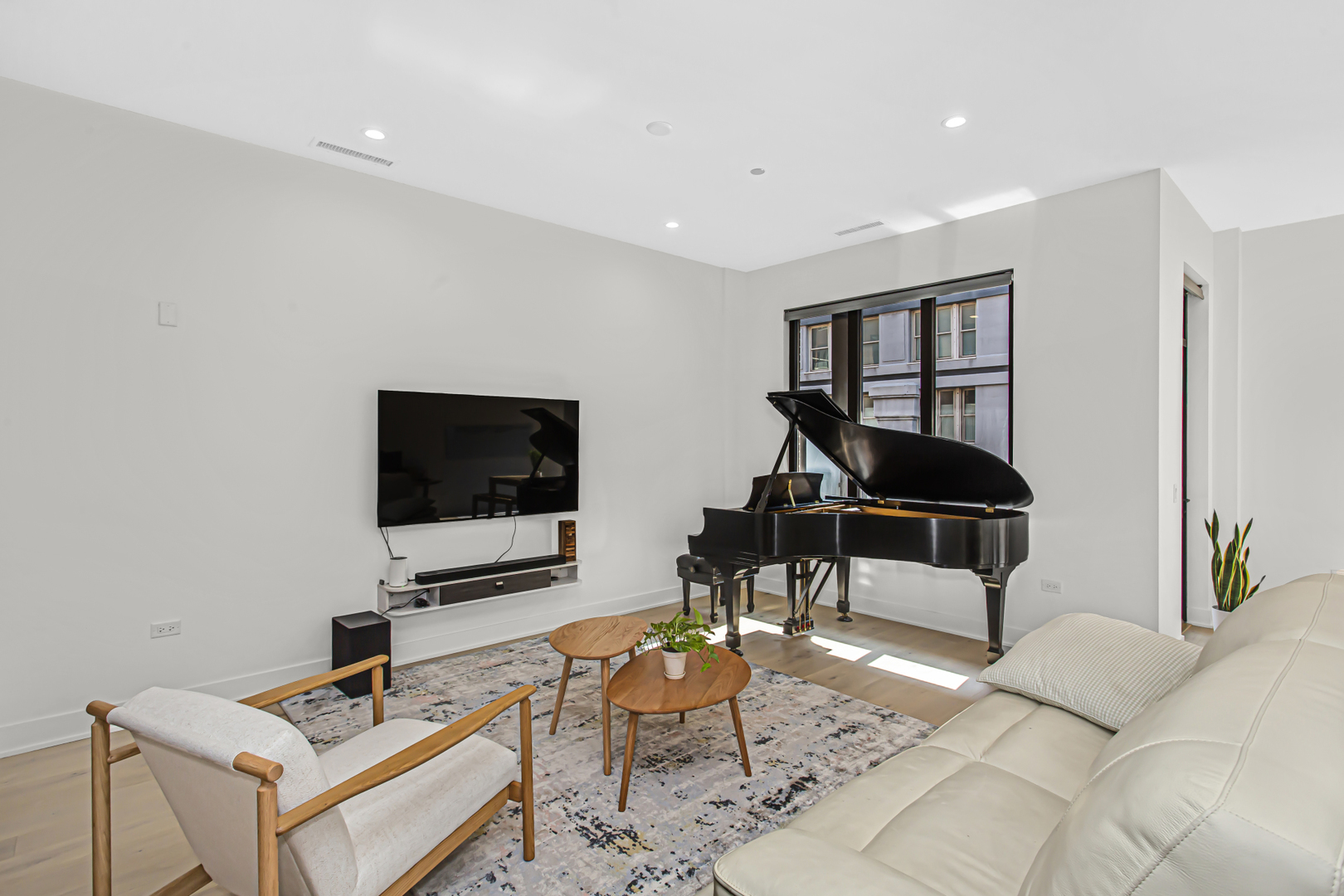 305 South Racine Avenue, Unit 5D Chicago, IL 60607 - Photo 8 of 31 a living room with furniture and a flat screen tv