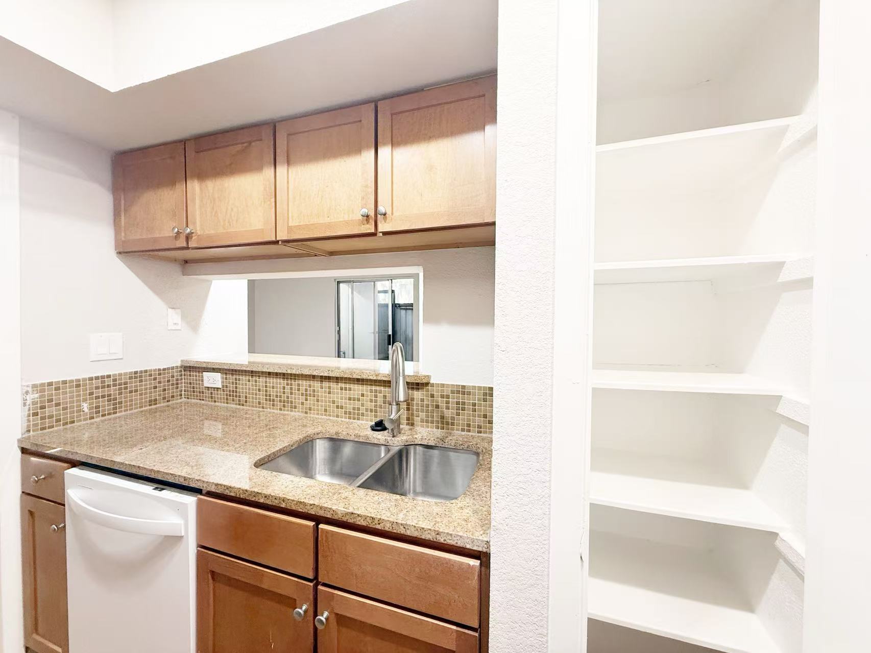 3204 Menchaca Road, Unit 601 Austin, TX 78704 - Photo 3 of 12 a sink sitting next to a window