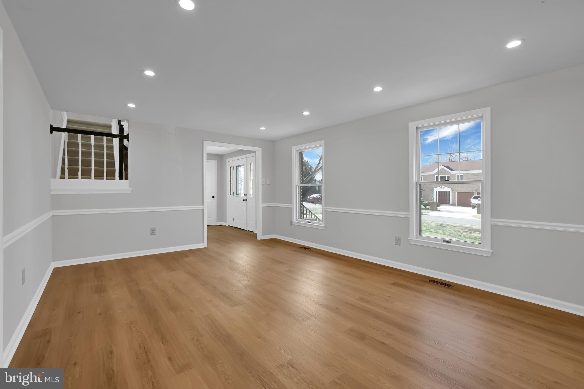 15101 Snowden Drive Silver Spring, MD 20905 - Photo 14 of 68 a view of an empty room with wooden floor and a window