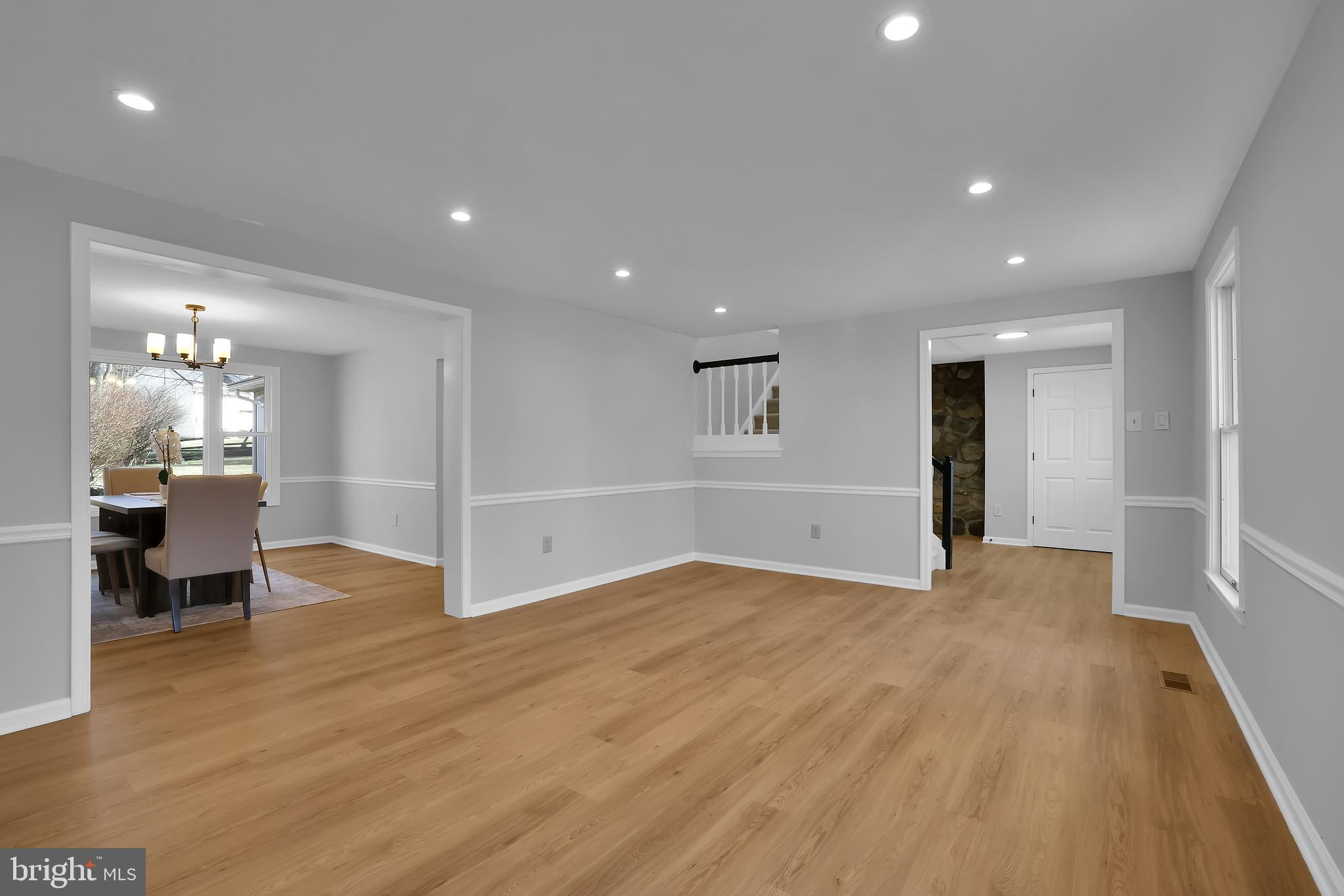 15101 Snowden Drive Silver Spring, MD 20905 - Photo 15 of 68 a view of an empty room with wooden floor and a window