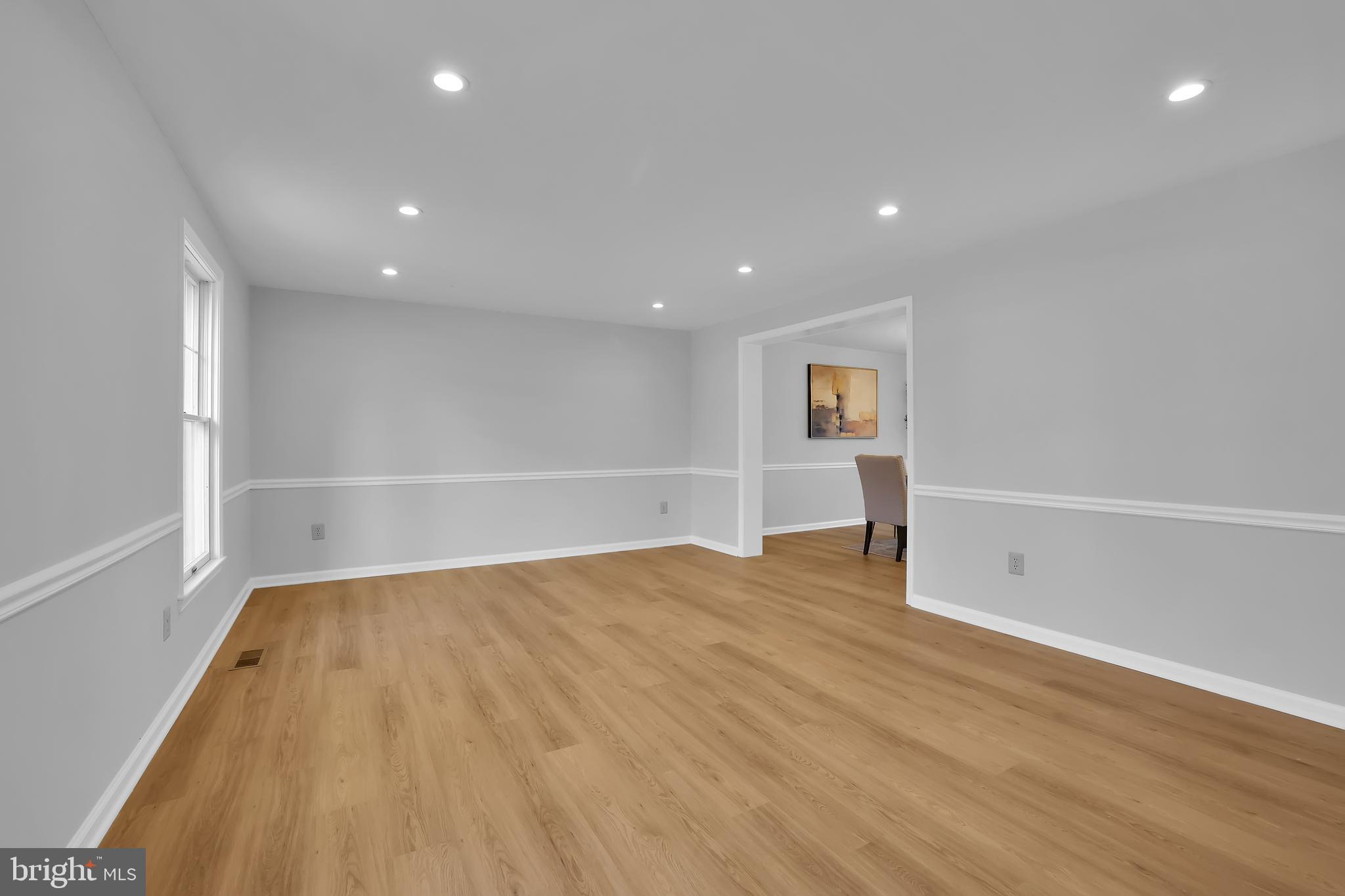 15101 Snowden Drive Silver Spring, MD 20905 - Photo 16 of 68 a view of an empty room with wooden floor and closet