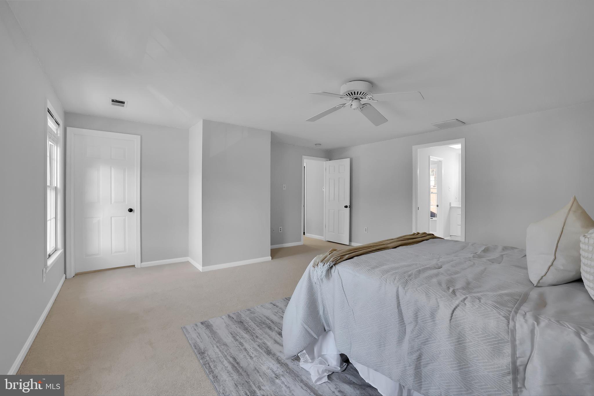 15101 Snowden Drive Silver Spring, MD 20905 - Photo 40 of 68 a view of a bedroom with a bed and ceiling fan