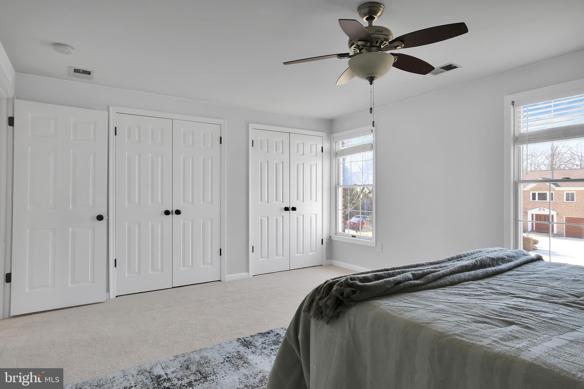 15101 Snowden Drive Silver Spring, MD 20905 - Photo 50 of 68 a bedroom with a bed and a chandelier
