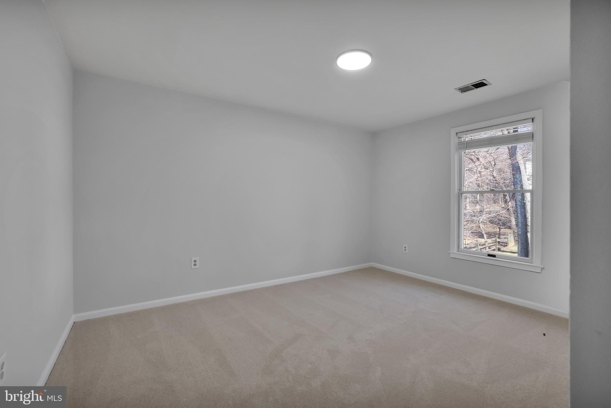 15101 Snowden Drive Silver Spring, MD 20905 - Photo 51 of 68 an empty room with a window