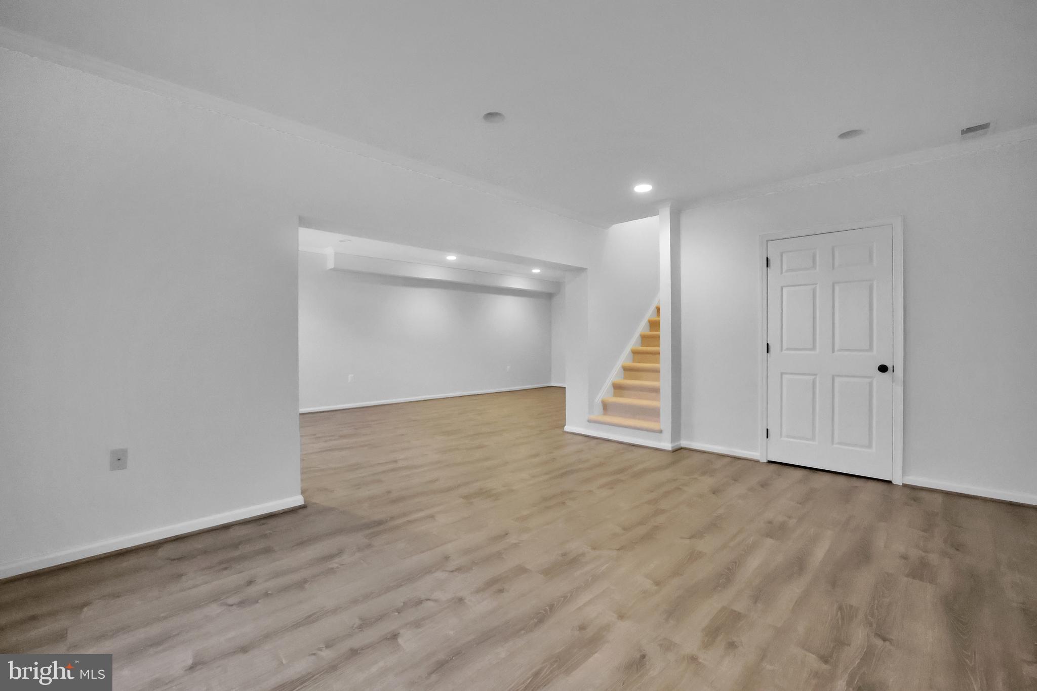 15101 Snowden Drive Silver Spring, MD 20905 - Photo 56 of 68 a view of an empty room with wooden floor