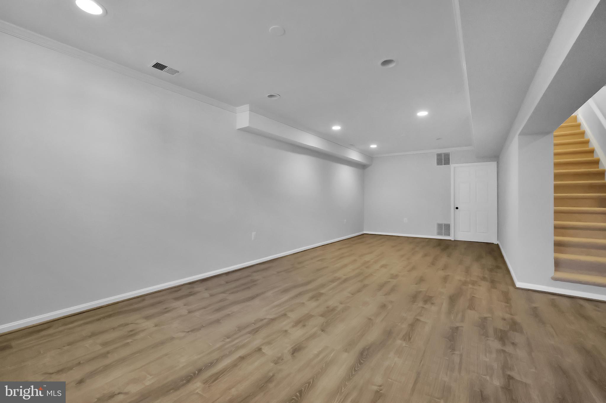 15101 Snowden Drive Silver Spring, MD 20905 - Photo 57 of 68 wooden floor in an empty room with a window
