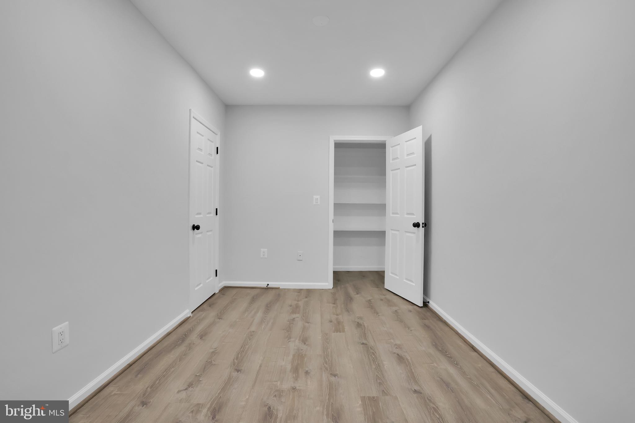 15101 Snowden Drive Silver Spring, MD 20905 - Photo 60 of 68 a view of empty room with wooden floor
