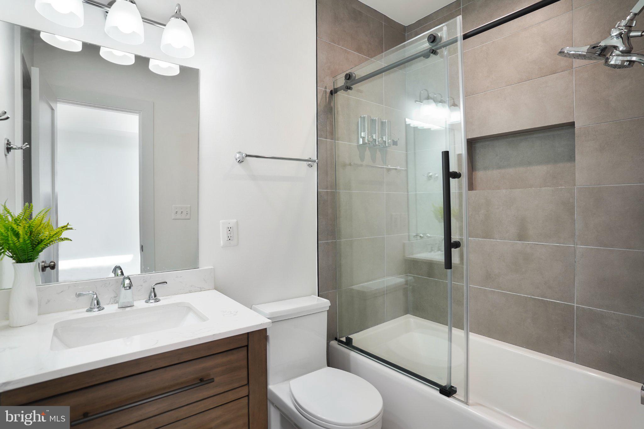 112 V Street Northeast Washington, DC 20002 - Photo 19 of 25 a bathroom with a sink toilet tub and shower