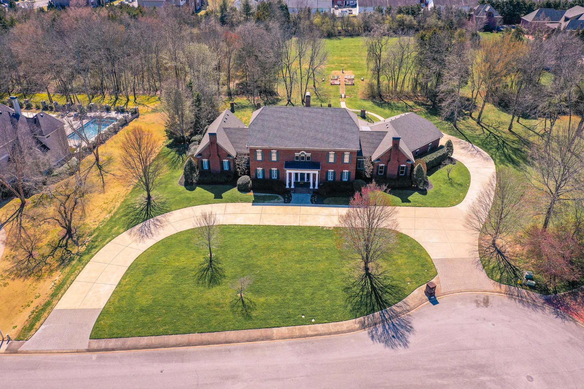 1727 Shagbark Trail Murfreesboro, TN 37130 - Photo 2 of 32 an aerial view of a house with swimming pool and large trees