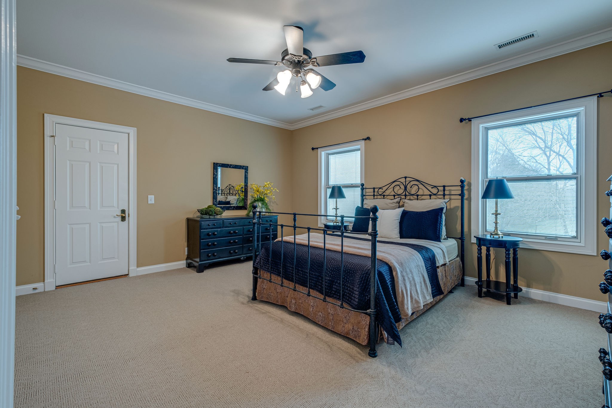 1727 Shagbark Trail Murfreesboro, TN 37130 - Photo 23 of 32 a spacious bedroom with a bed and a chandelier