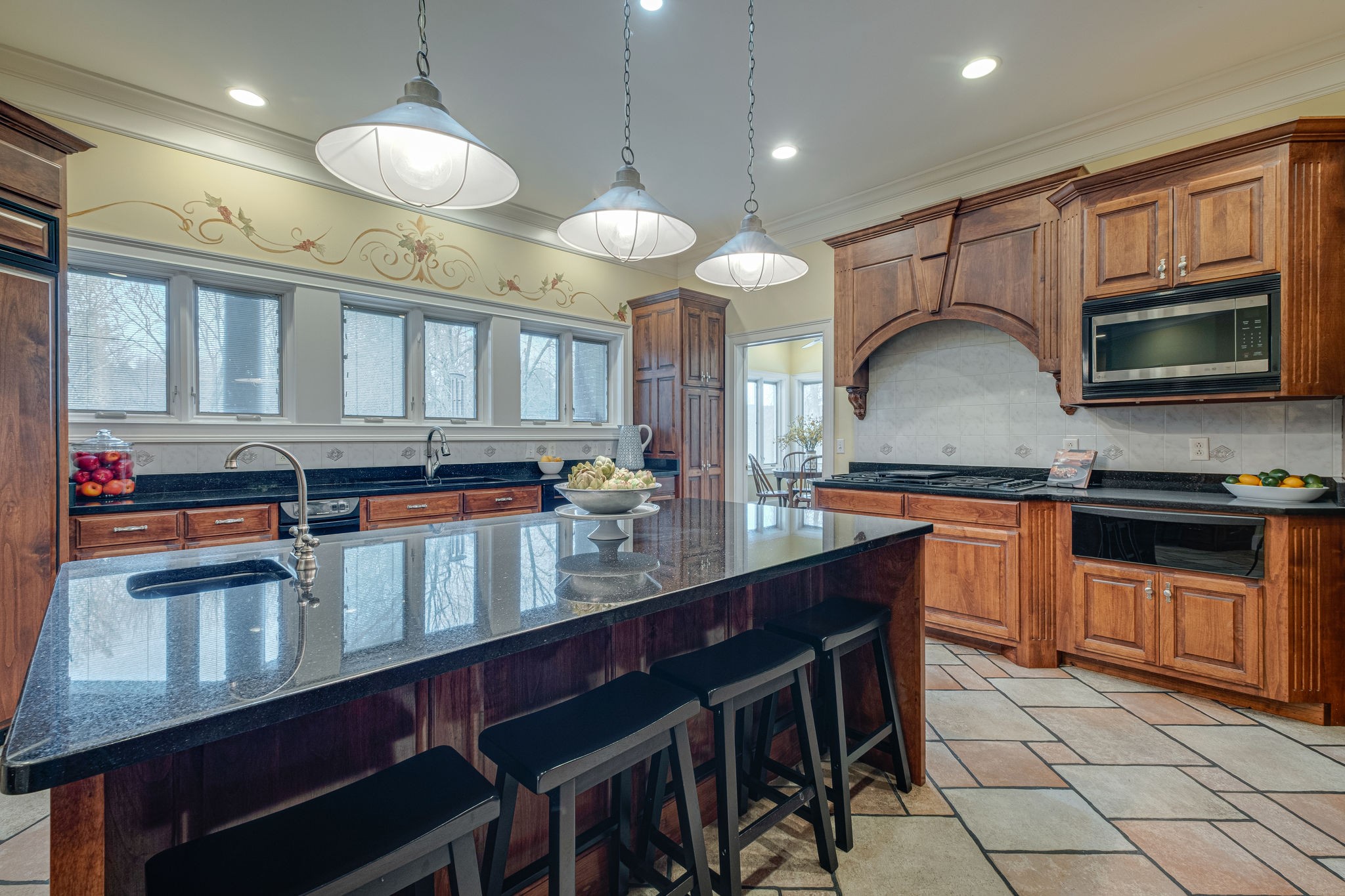 1727 Shagbark Trail Murfreesboro, TN 37130 - Photo 9 of 32 a kitchen with granite countertop a stove a sink and a wooden cabinets