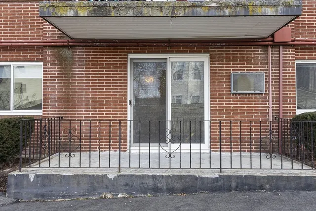 a view of a brick house with a door