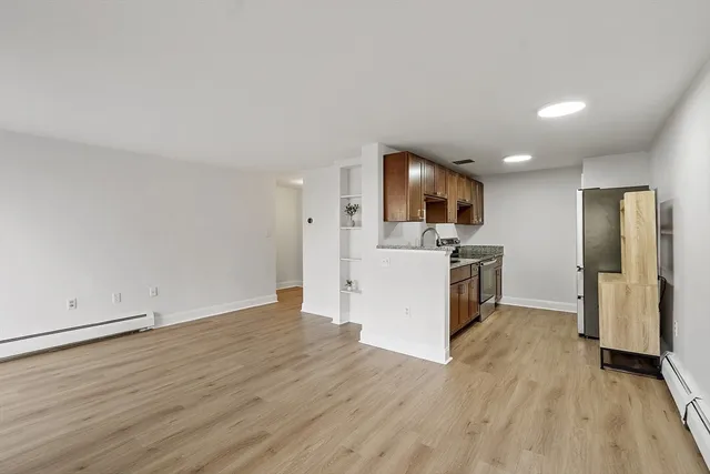 a view of kitchen with sink microwave and refrigerator