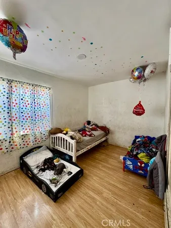 a bedroom with furniture and a window