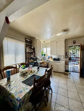 a kitchen with a cabinets and white appliances
