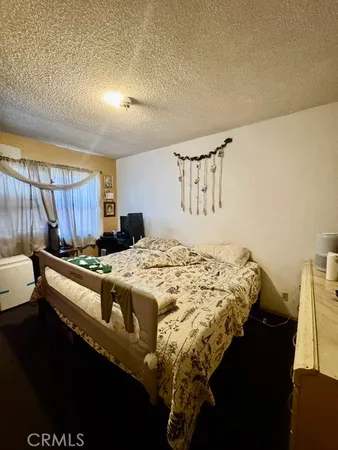 a bedroom with a bed and cabinets