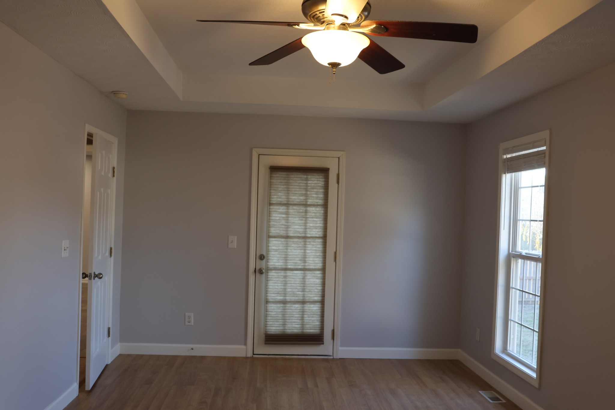 148 Stanley Drive Gallatin, TN 37066 - Photo 16 of 32 an empty room with wooden floor fan and windows