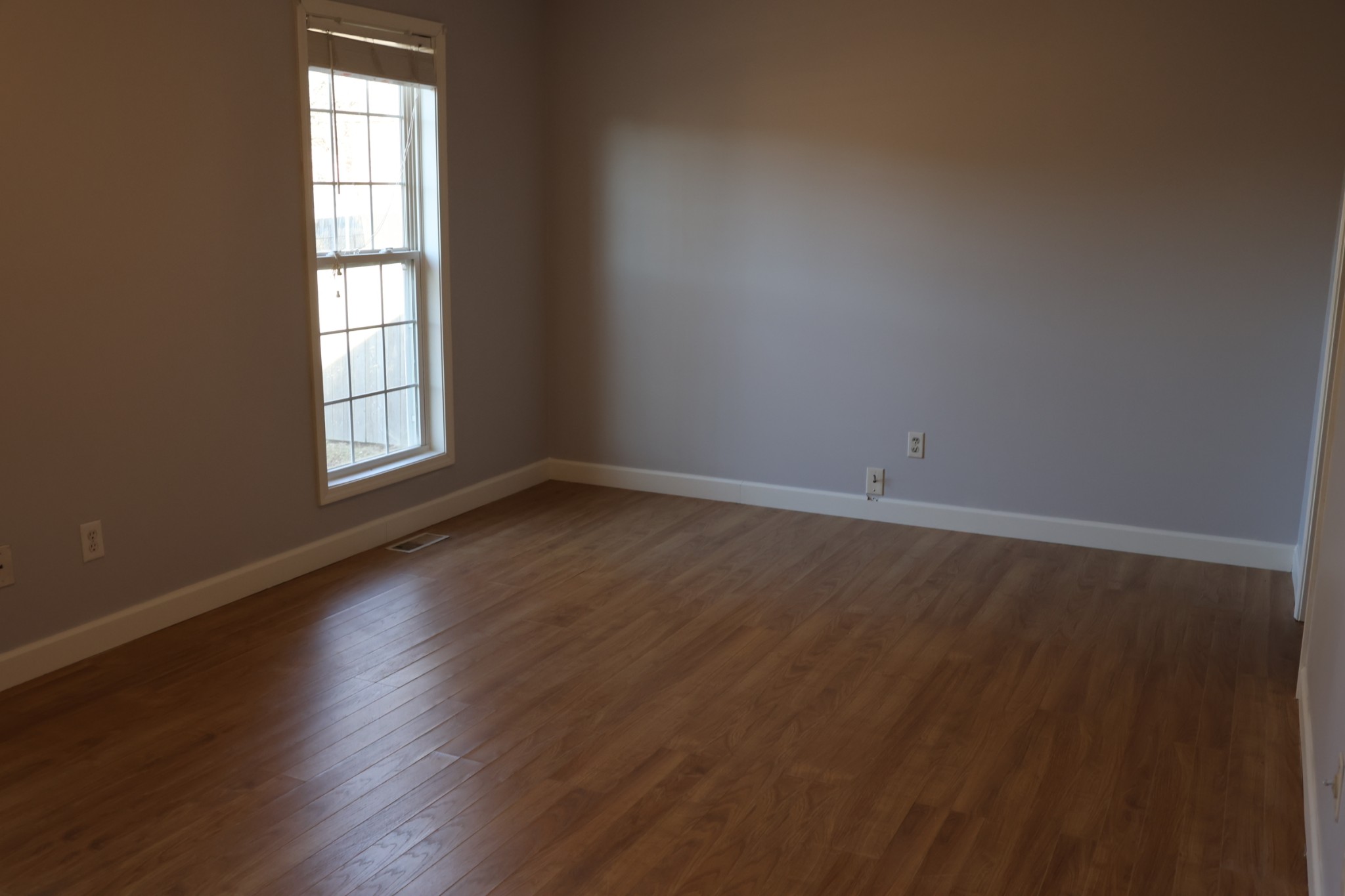148 Stanley Drive Gallatin, TN 37066 - Photo 18 of 32 an empty room with wooden floor and windows