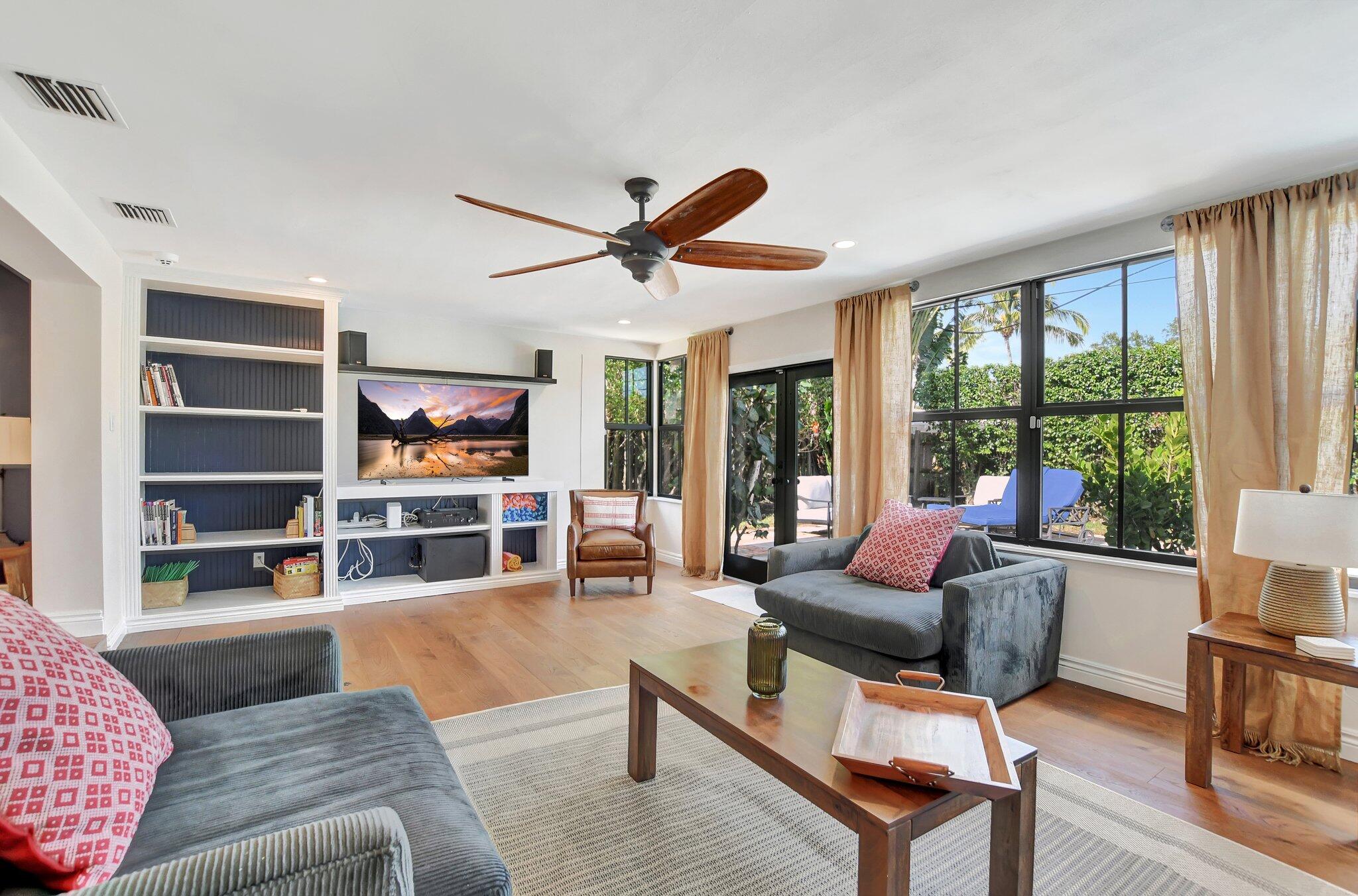 801 Southwest 5th Street Boca Raton, FL 33486 - Photo 19 of 50 a living room with furniture and a large window with rug floor