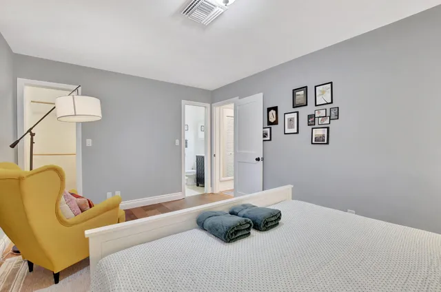 a bedroom with a bed and window