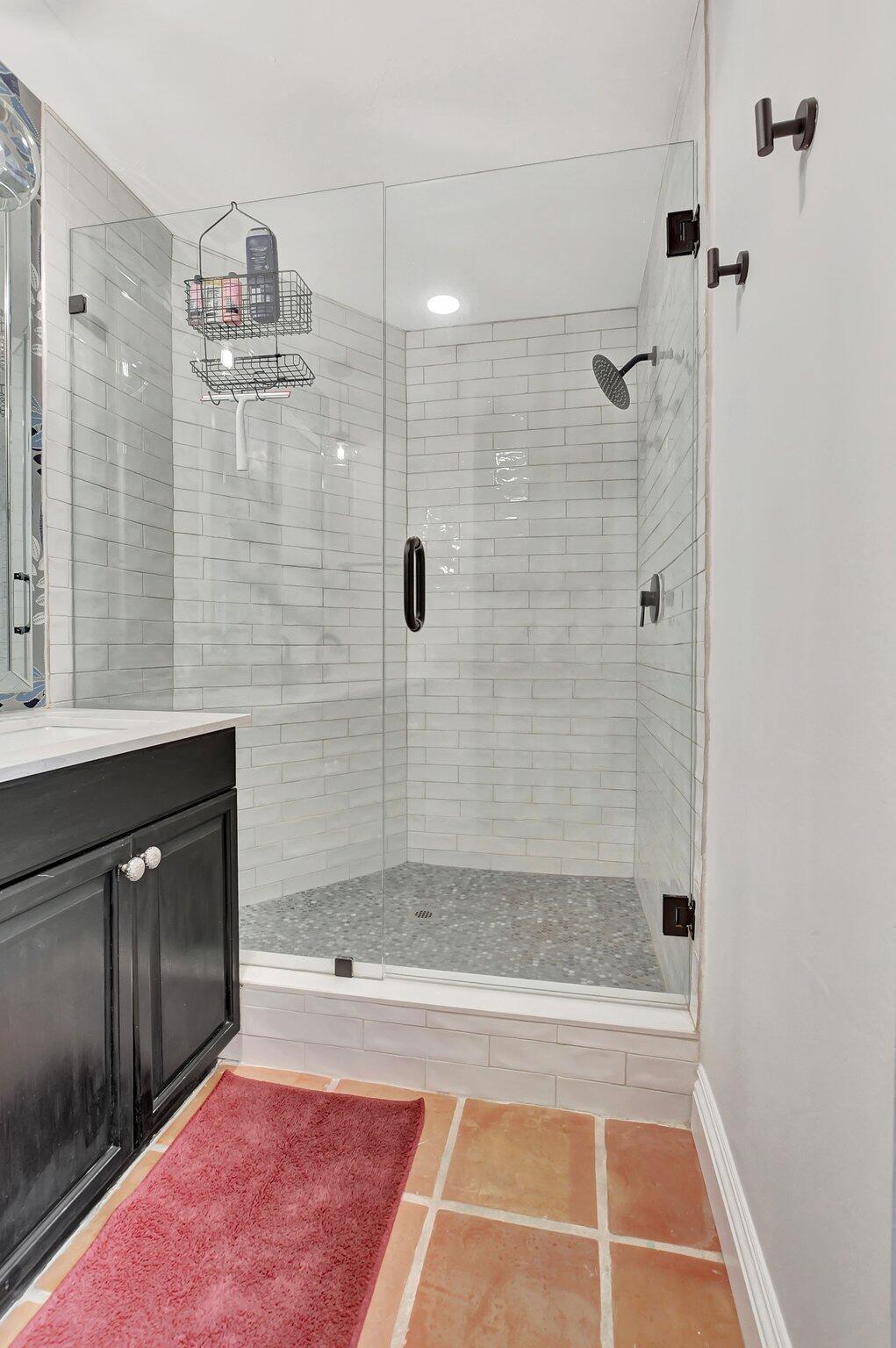 801 Southwest 5th Street Boca Raton, FL 33486 - Photo 33 of 50 a bathroom with a bathtub and a shower