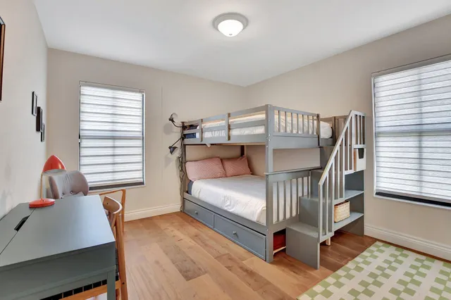 a bedroom with furniture and a window
