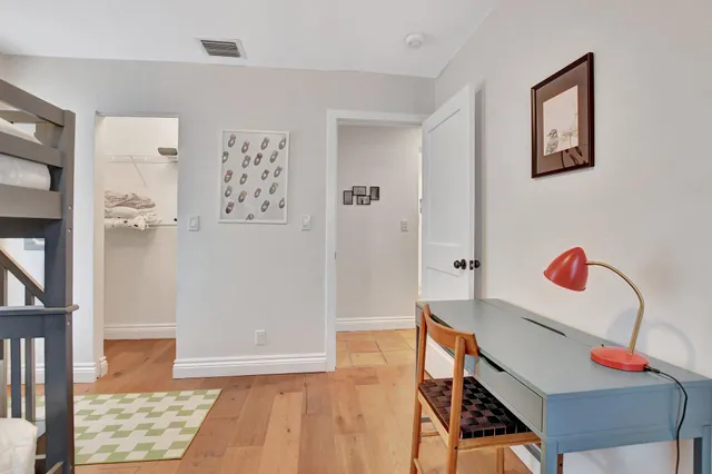 a view of room with furniture and wooden floor