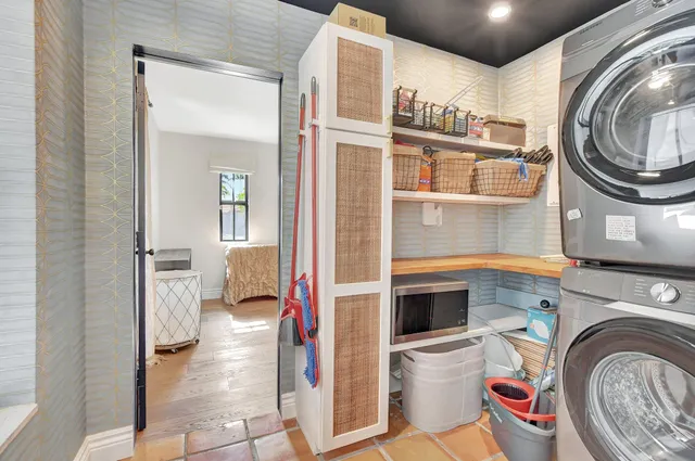 a utility room with closet dryer and washer