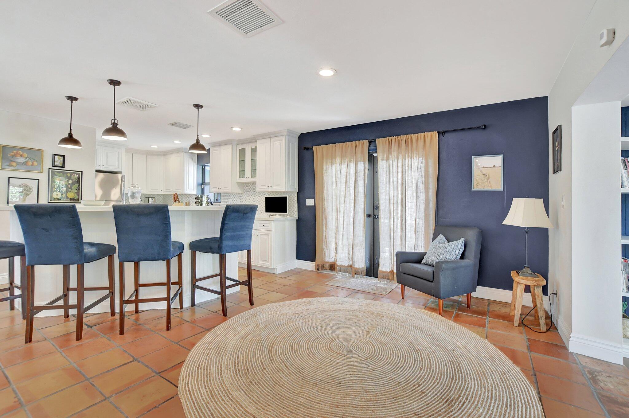 801 Southwest 5th Street Boca Raton, FL 33486 - Photo 9 of 50 a large kitchen with a table and chairs
