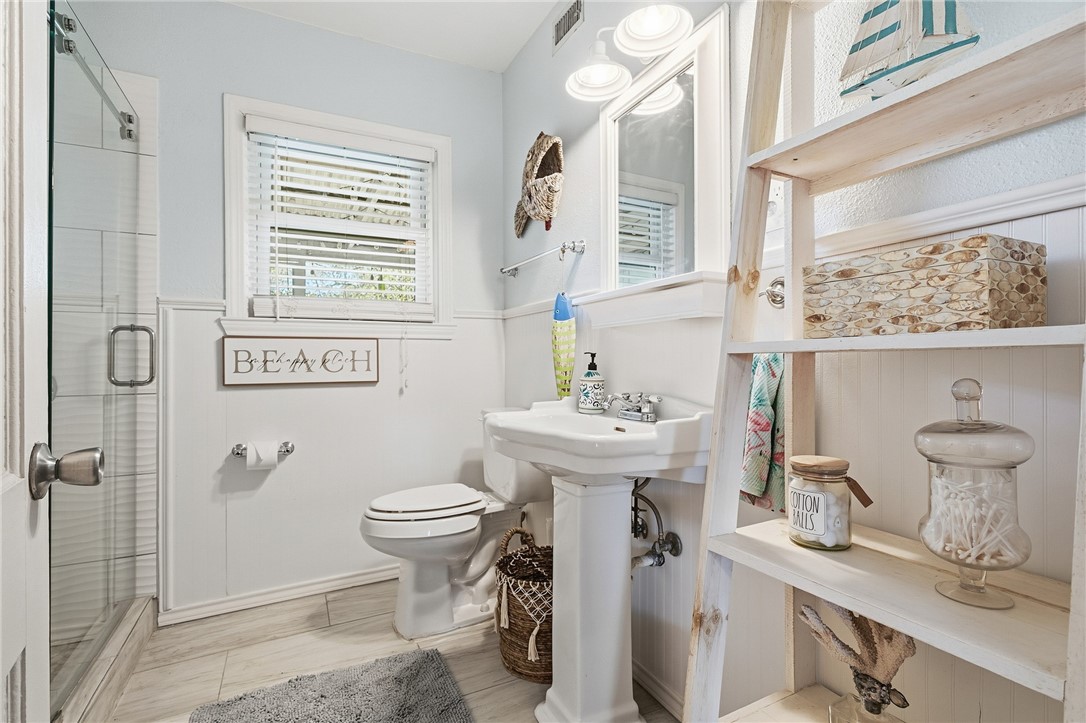 607 Chaparral Street Fulton, TX 78382 - Photo 17 of 40 a bathroom with a sink toilet and shower