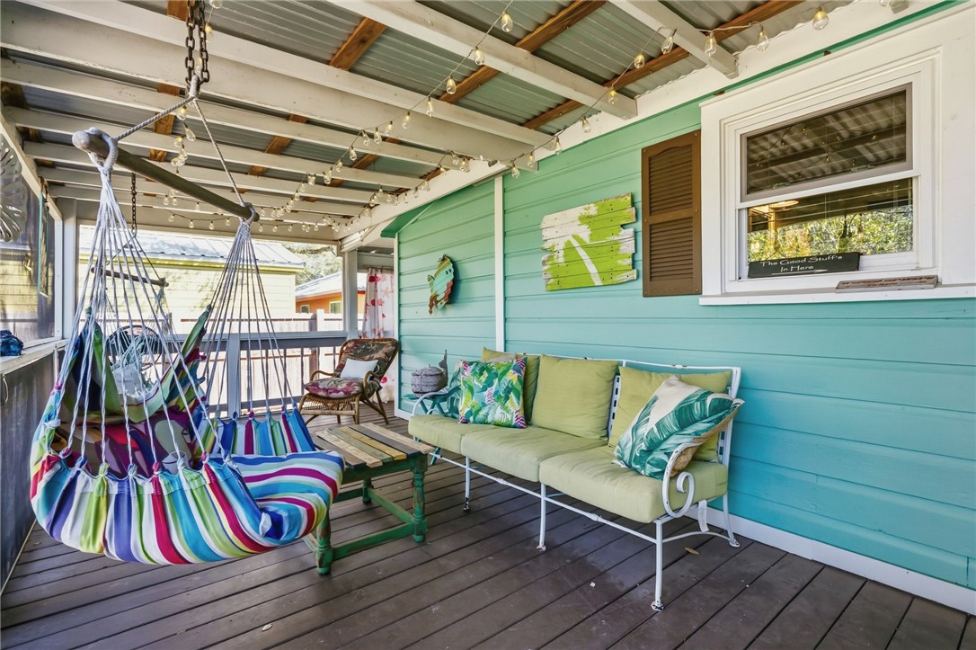 607 Chaparral Street Fulton, TX 78382 - Photo 24 of 40 a living room with furniture and a wooden floor