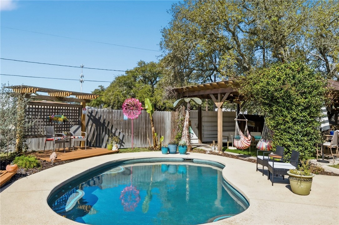 607 Chaparral Street Fulton, TX 78382 - Photo 28 of 40 a view of swimming pool with outdoor seating and plants
